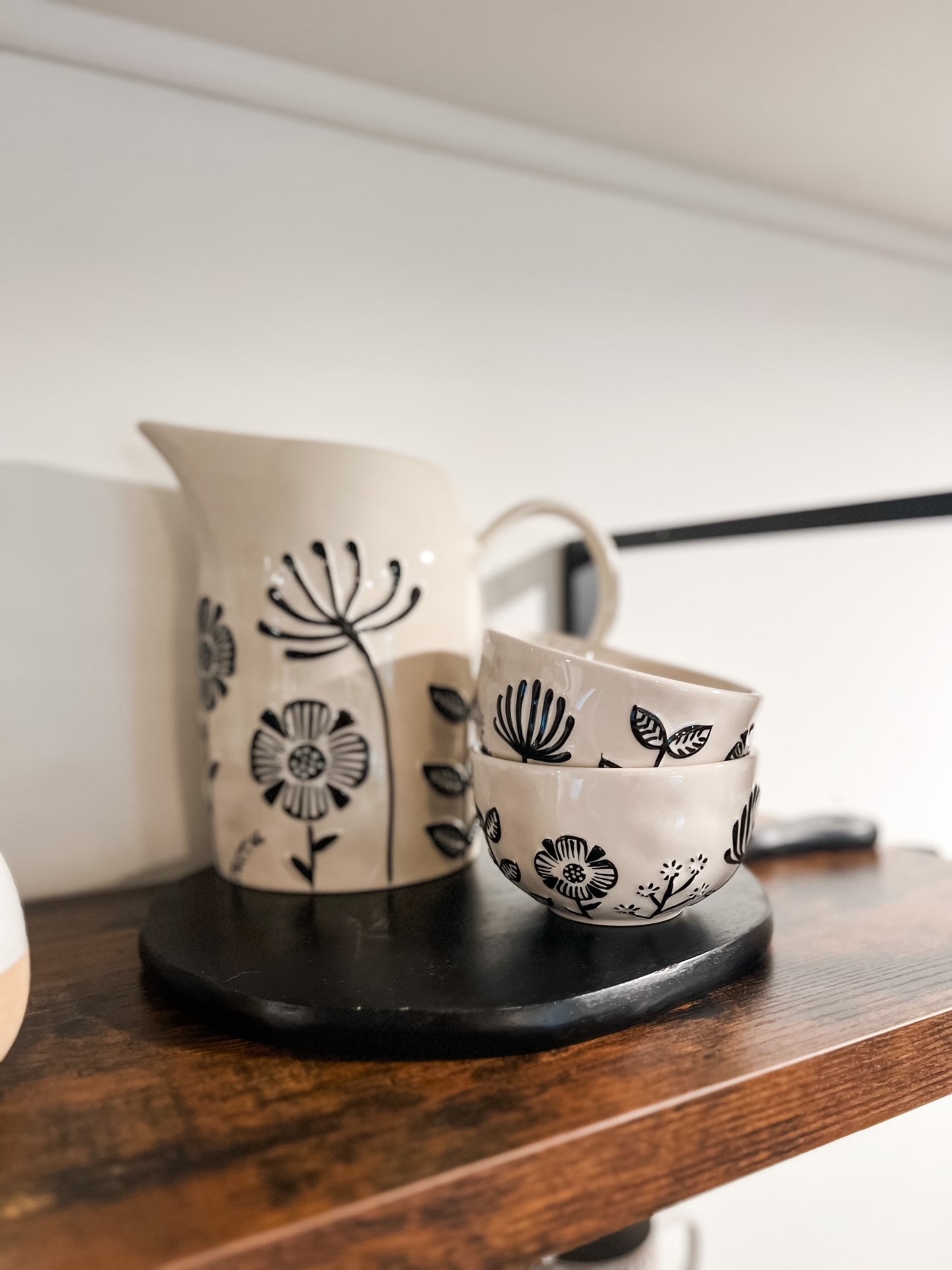 HAND PAINTED STONEWARE BOWL WITH EMBOSSED FLOWERS
